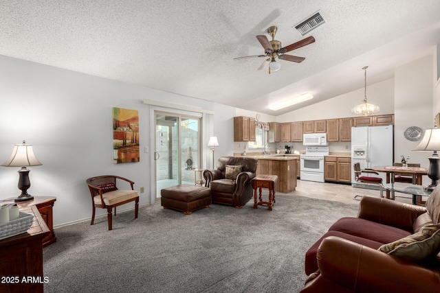 6424 E Aire Libre Ln, Scottsdale, AZ 85254 - living room featuring a ceiling fan, vaulted ceiling, a textured ceiling, and light colored carpet