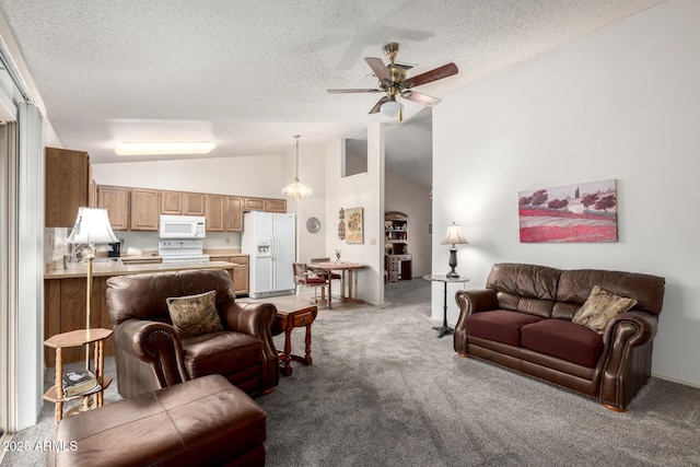 6424 E Aire Libre Ln, Scottsdale, AZ 85254 - living area with carpet floors, vaulted ceiling, ceiling fan, a textured ceiling, and baseboards