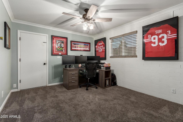 carpeted home office with brick wall, ceiling fan, and crown molding