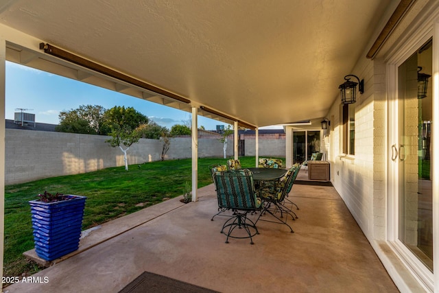 view of patio featuring a fenced backyard and outdoor dining space