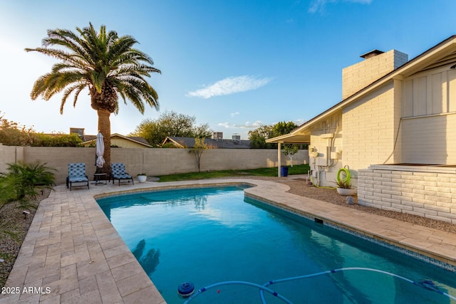 view of swimming pool with a fenced in pool, a patio, and a fenced backyard