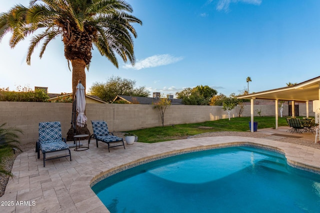 view of pool with a patio, a fenced in pool, and a fenced backyard