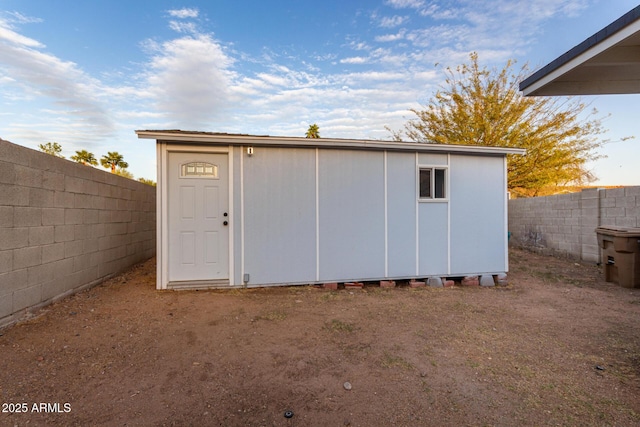 view of outbuilding featuring an outdoor structure and a fenced backyard