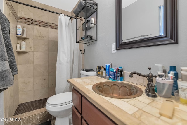 bathroom featuring vanity, a shower with curtain, and toilet