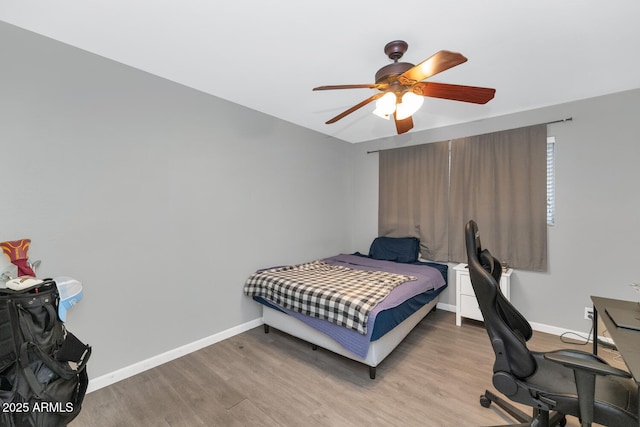 bedroom with ceiling fan and light wood-type flooring