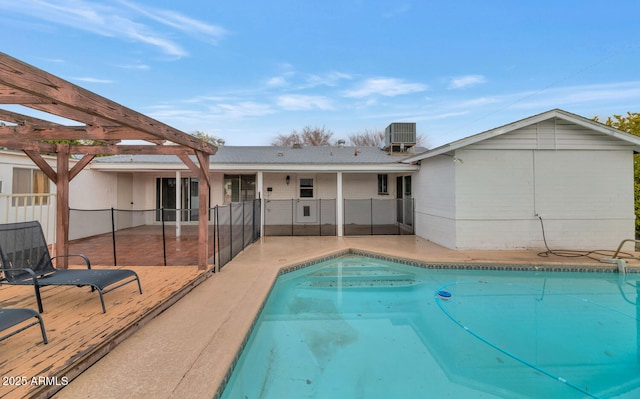 view of pool featuring cooling unit, a pergola, and a patio