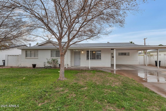 ranch-style house with a front lawn and a carport