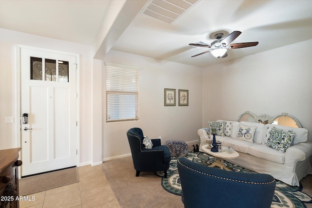 living room with light tile patterned floors and ceiling fan