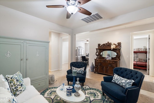 tiled living room featuring ceiling fan