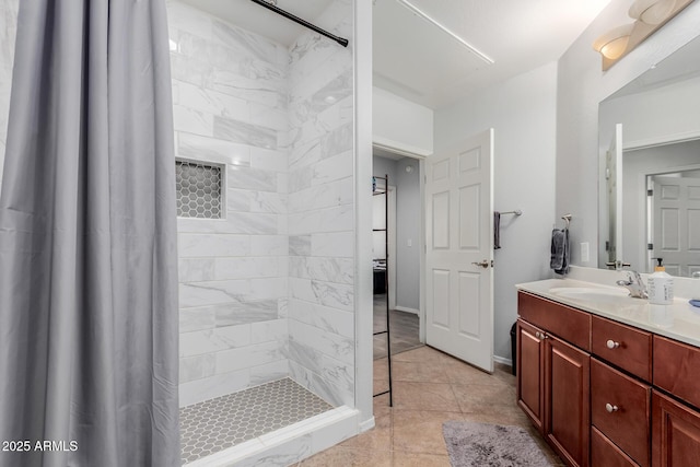 bathroom with vanity and tiled shower