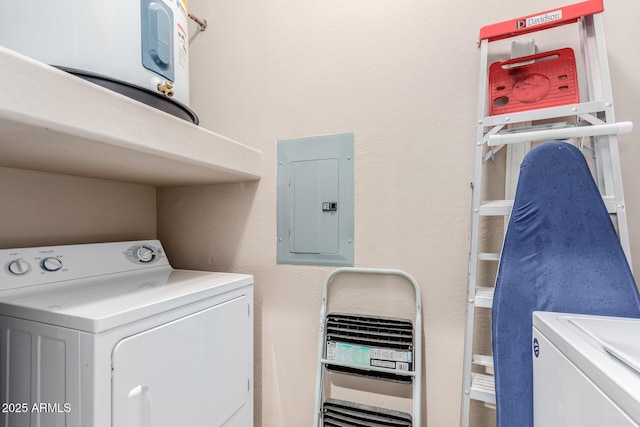 laundry room featuring laundry area, washer and clothes dryer, and electric panel