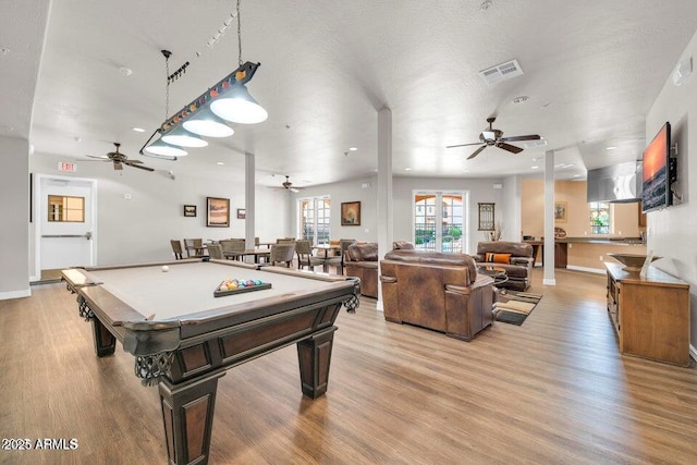 recreation room with pool table, a ceiling fan, light wood finished floors, and visible vents