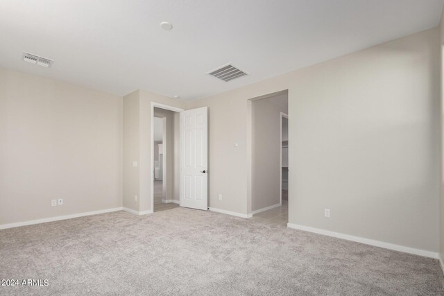 empty room with light colored carpet