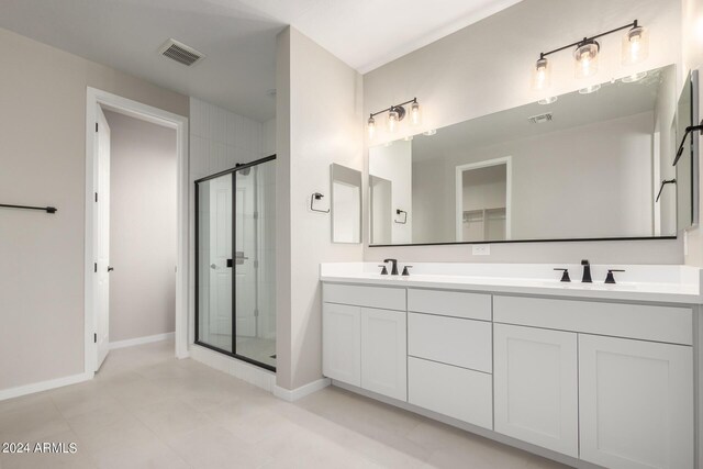 bathroom with vanity and an enclosed shower