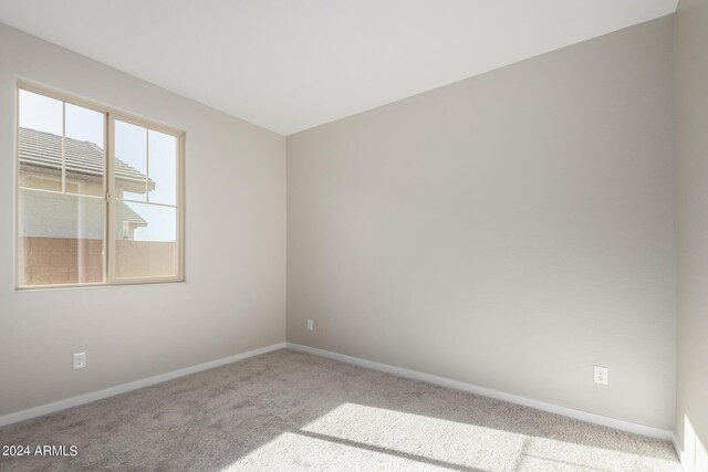 empty room featuring light colored carpet