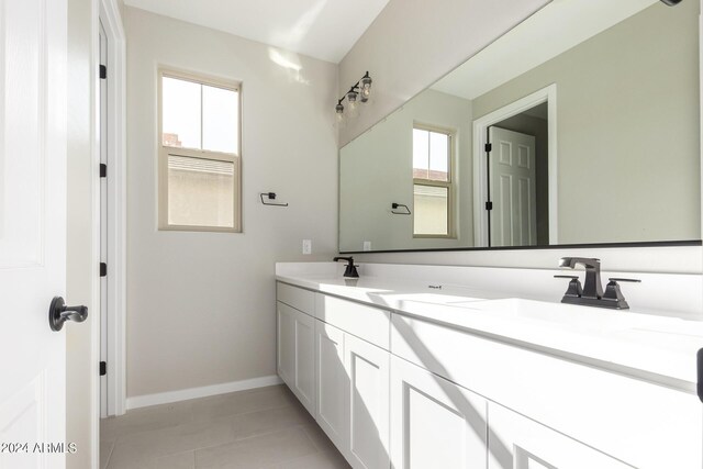 bathroom featuring tile patterned flooring and vanity