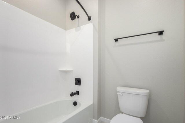 bathroom featuring toilet and tub / shower combination