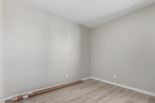 spare room with light wood-type flooring