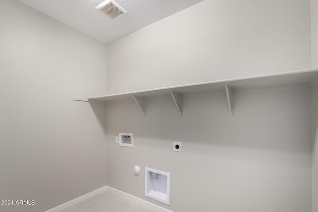 laundry room featuring washer hookup, electric dryer hookup, light colored carpet, and hookup for a gas dryer