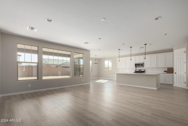 unfurnished living room featuring light hardwood / wood-style flooring