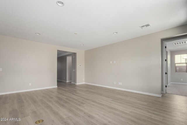 empty room with light hardwood / wood-style floors