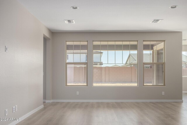 spare room with hardwood / wood-style flooring