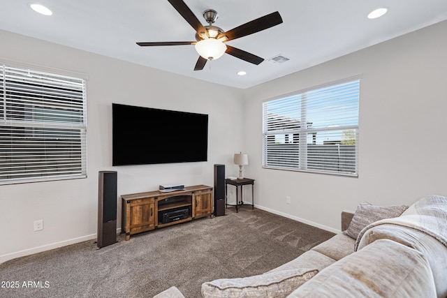 living room featuring visible vents, baseboards, a ceiling fan, carpet, and recessed lighting