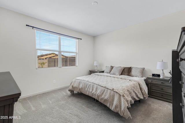 bedroom featuring carpet floors and baseboards