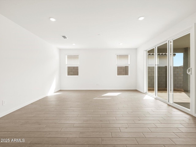 17703 W Southgate Ave, Goodyear, AZ 85338 - unfurnished room with visible vents, recessed lighting, baseboards, and wood finished floors