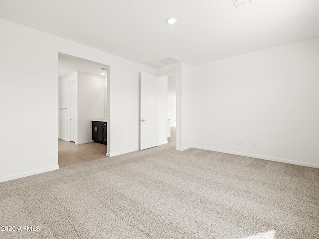 17703 W Southgate Ave, Goodyear, AZ 85338 - empty room with recessed lighting, baseboards, and light carpet