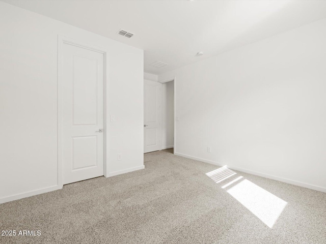 17703 W Southgate Ave, Goodyear, AZ 85338 - empty room with carpet flooring, baseboards, and visible vents