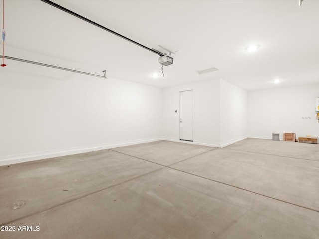 17703 W Southgate Ave, Goodyear, AZ 85338 - garage featuring a garage door opener and baseboards