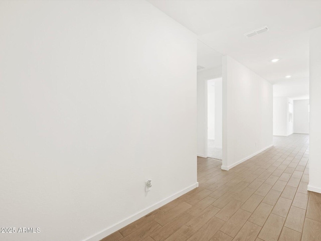 17703 W Southgate Ave, Goodyear, AZ 85338 - unfurnished room with recessed lighting, visible vents, baseboards, and light wood finished floors
