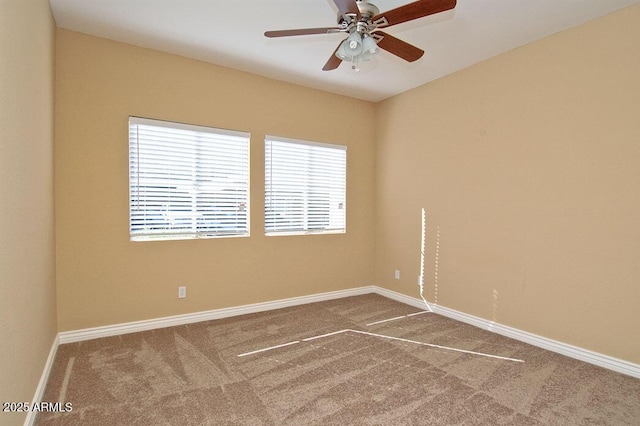 spare room with carpet and ceiling fan