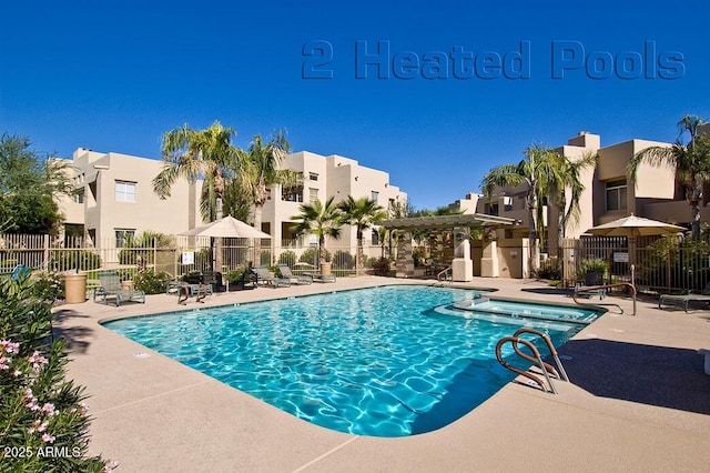 view of swimming pool with a pergola and a patio