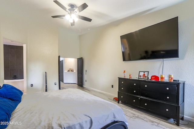 bedroom with baseboards and a ceiling fan