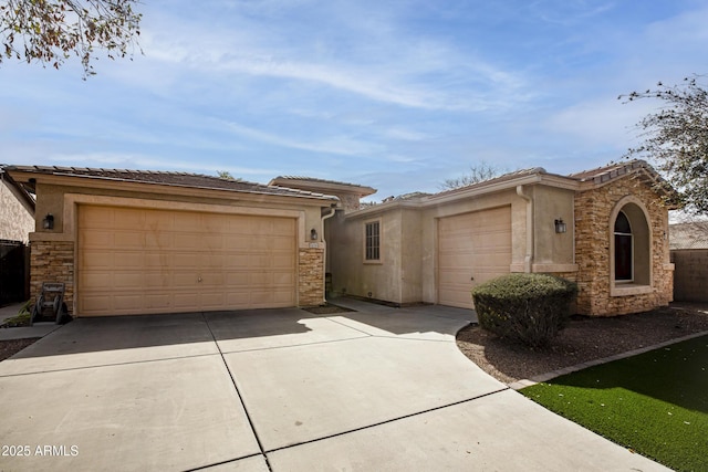 view of front facade featuring stone siding, an attached garage, driveway, and stucco siding