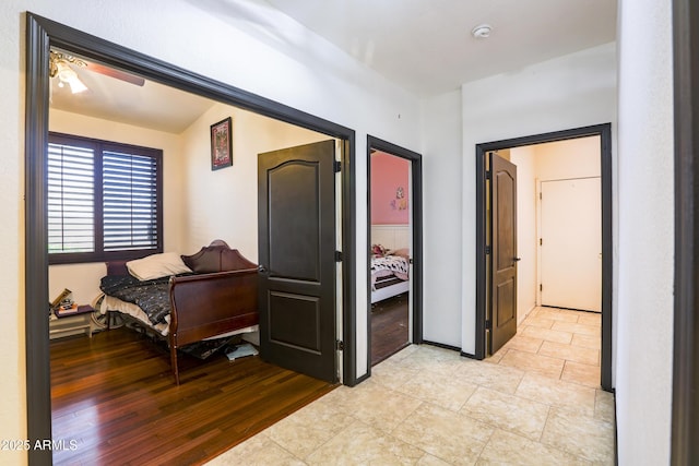 corridor featuring light wood finished floors