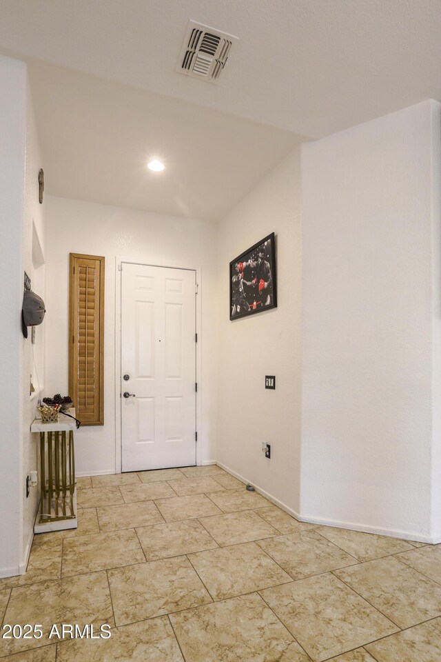 entrance foyer with visible vents and baseboards