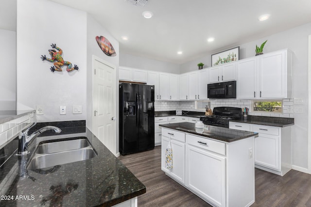 kitchen featuring black appliances, dark hardwood / wood-style floors, white cabinets, and sink