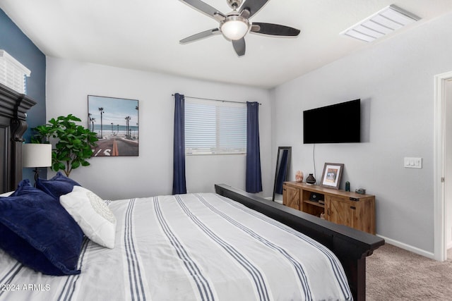 bedroom with ceiling fan and carpet