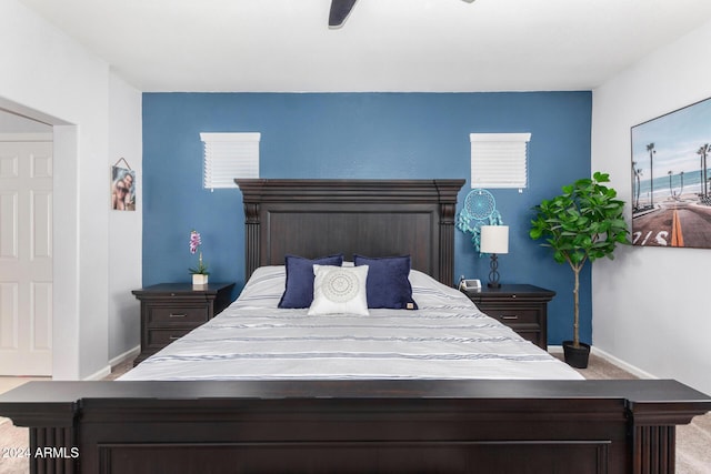 carpeted bedroom with ceiling fan