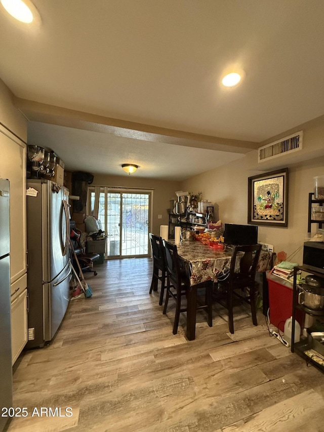 dining room with light hardwood / wood-style floors