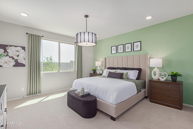 bedroom featuring light carpet, baseboards, and recessed lighting