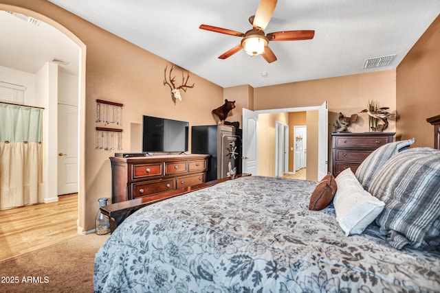 21604 E Calle De Flores, Queen Creek, AZ 85142 - carpeted bedroom featuring a ceiling fan, arched walkways, and visible vents