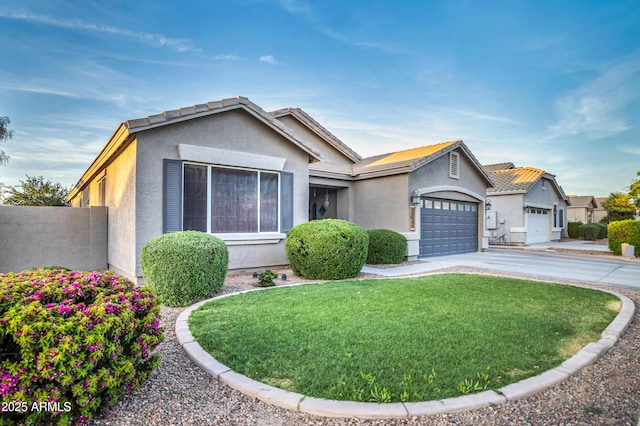21604 E Calle De Flores, Queen Creek, AZ 85142 - view of front of home featuring a tile roof, stucco siding, an attached garage, driveway, and a front yard