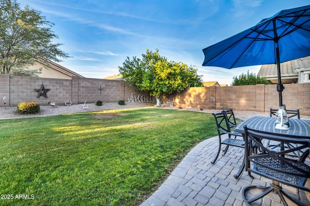 21604 E Calle De Flores, Queen Creek, AZ 85142 - view of yard featuring a fenced backyard, outdoor dining area, and a patio area