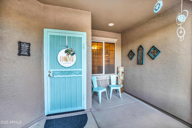 21604 E Calle De Flores, Queen Creek, AZ 85142 - doorway to property with stucco siding and covered porch