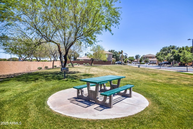 21604 E Calle De Flores, Queen Creek, AZ 85142 - view of property's community featuring a patio, fence, and a lawn