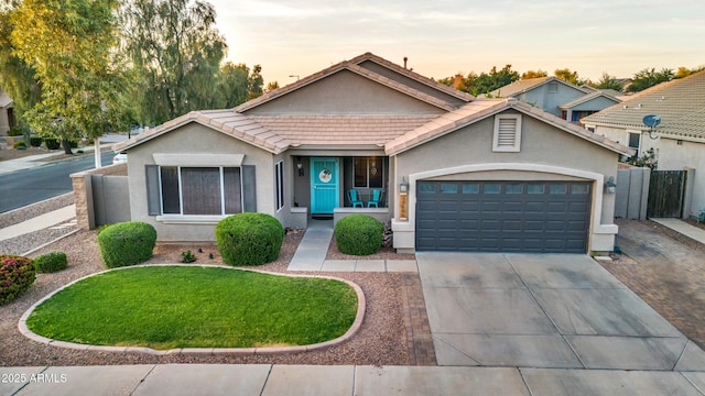 21604 E Calle De Flores, Queen Creek, AZ 85142 - ranch-style house featuring driveway, a tile roof, stucco siding, fence, and a garage